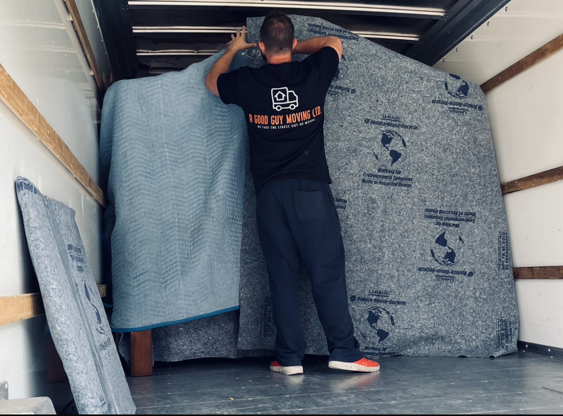Professional mover carefully handling furniture